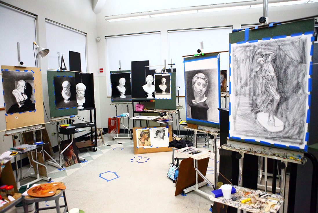 Art studio filled with easels and paintings