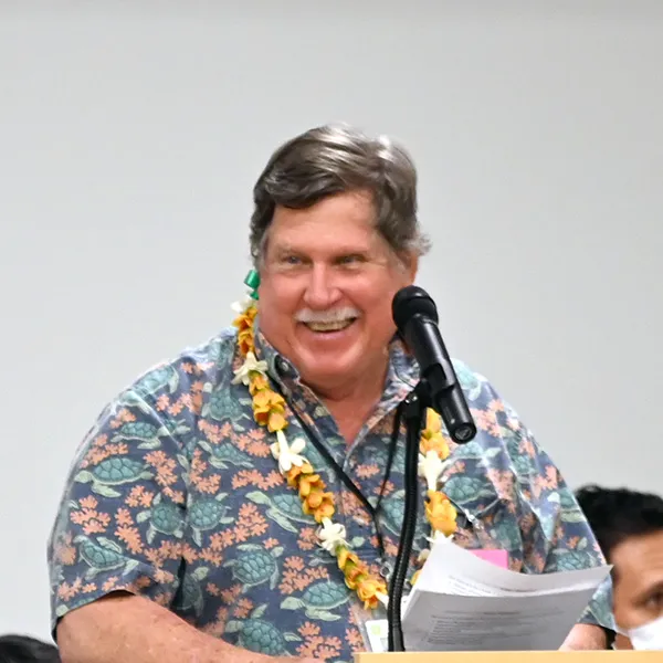 Dave Krupp speaking at a podium